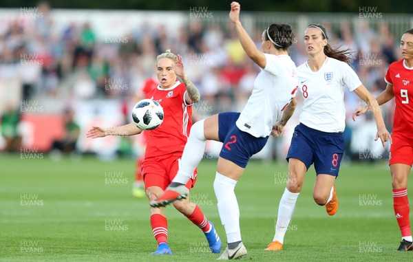 310818 - Wales Women v England Women - FIFA World Cup Qualifier - Jess Fishlock of Wales challenges Lucy Bronze of England