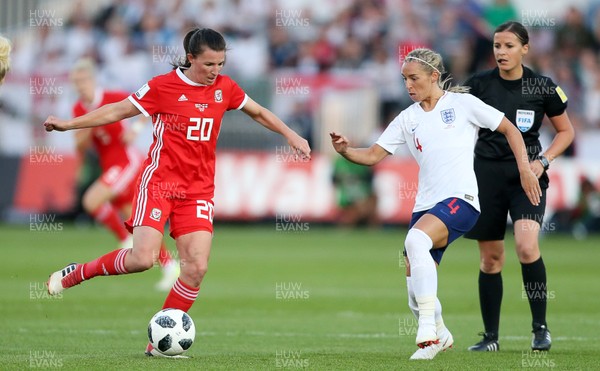 310818 - Wales Women v England Women - FIFA World Cup Qualifier - Helen Ward of Wales is challenged by Jordan Nobbs of England