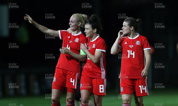310818 - Wales Women v England Women - FIFA World Cup Qualifier - Hayley Ladd, Angharad James and Hayley Ladd of Wales wave at fans