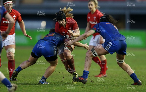 160318 - Wales Women v France Women - Natwest 6 Nations Championship - Bethan Lewis of Wales is tackled by Agathe Sochat of France