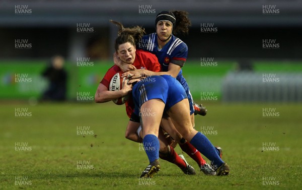 160318 - Wales Women v France Women - Natwest 6 Nations Championship - Robyn Wilkins of Wales is tackled by Celine Ferer and Carla Neisen of France