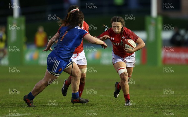 160318 - Wales Women v France Women - Natwest 6 Nations Championship - Alisha Butchers of Wales is tackled by Lise Arricastre of France