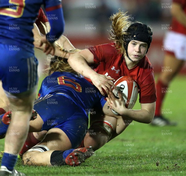160318 - Wales Women v France Women - Natwest 6 Nations Championship - Bethan Lewis of Wales is tackled by Marjorie Mayans of France