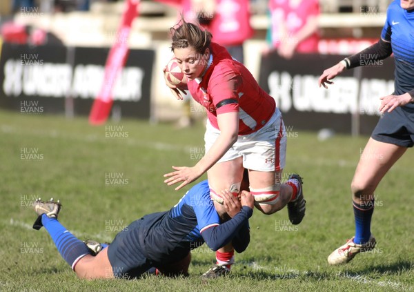 180312 Wales v France - Women's 6 Nations Championship -Wales' Sioned Harries is tackled by France's Agricole Sandrine