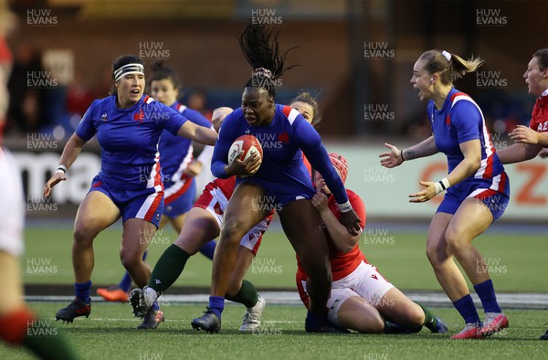 220422 - Wales Women v France Women - TikTok Womens Six Nations - Madoussou Fall of France is tackled by Siwan Lillicrap and Carys Phillips of Wales