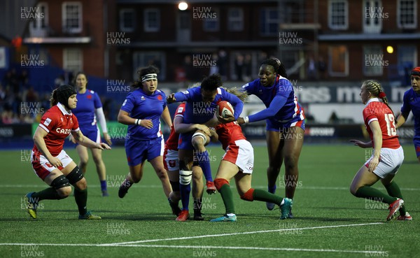 220422 - Wales Women v France Women - TikTok Womens Six Nations - Julie Annery of France is tackled by Alisha Butchers and Elinor Snowsill of Wales