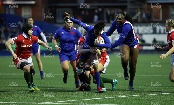 220422 - Wales Women v France Women - TikTok Womens Six Nations - Julie Annery of France is tackled by Alisha Butchers and Elinor Snowsill of Wales