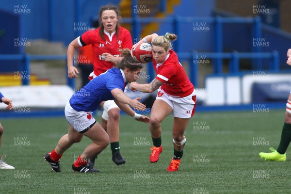 230220 - Wales Women v France Women - Women's 6Nations Championship -  Keira Bevan of Wales takes on Agathe Scochat of France 