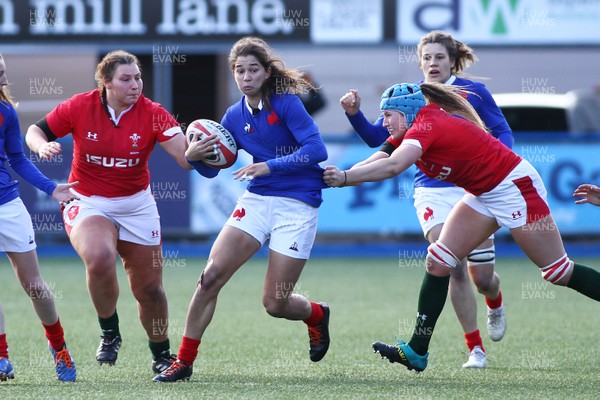 230220 - Wales Women v France Women - Women's 6Nations Championship -  Coraile Bertrand of France is tackled by Gwen Crabb of Wales 