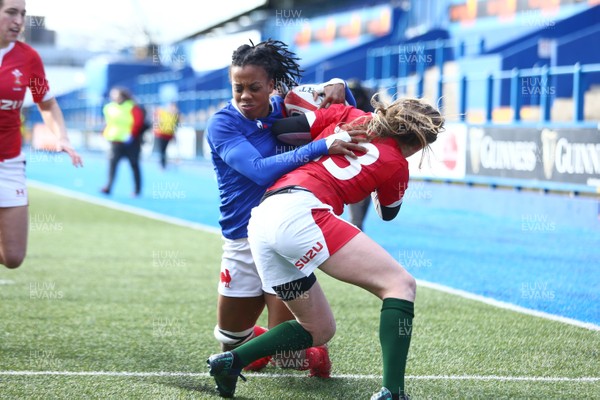 230220 - Wales Women v France Women - Women's 6Nations Championship -  Julie Annery of France powers through Lauren Smyth of Wales to score a try 