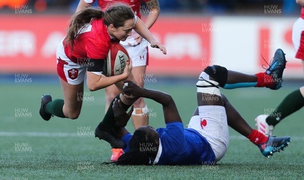 230220 - Wales Women v France Women, Womens Six Nations Championship 2020 - Caitlin Lewis of Wales is tackled by Coumba Tombe Diallo of France