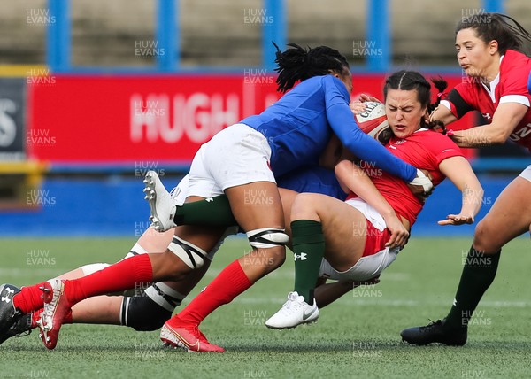 230220 - Wales Women v France Women, Womens Six Nations Championship 2020 - Ffion Lewis of Wales is tackled by Julie Annery of France