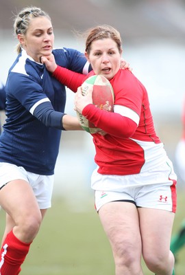 28.02.10 ... Wales Women v France Women, Womens Six Nations, Bridgend -  Wales' Jenny Davies holds off France's Marie-Alice Yahe  