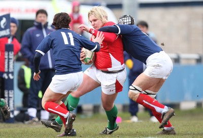 28.02.10 ... Wales Women v France Women, Womens Six Nations, Bridgend -  Wales' Catrin Edwards is caught by France's Sandra Rabier and France's Caroline Ladagnous   