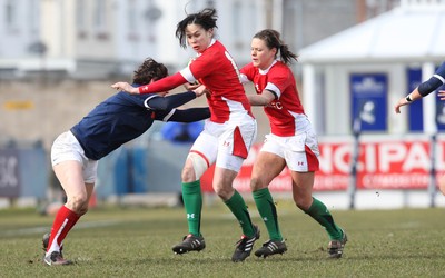 28.02.10 ... Wales Women v France Women, Womens Six Nations, Bridgend -  Wales' Naomi Thomas is held by France's Caroline Ladagnous   