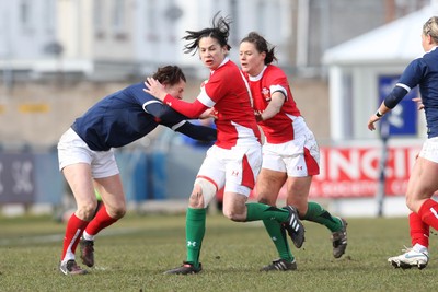 28.02.10 ... Wales Women v France Women, Womens Six Nations, Bridgend -  Wales' Naomi Thomas is held by France's Caroline Ladagnous   