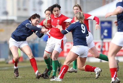 28.02.10 ... Wales Women v France Women, Womens Six Nations, Bridgend -  Wales' naomi Thomas is held by France's Caroline Ladagnous   