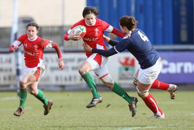 28.02.10 ... Wales Women v France Women, Womens Six Nations, Bridgend -  Wales' Naomi Thomas is tackled by France's Marie Charlotte Hebel   