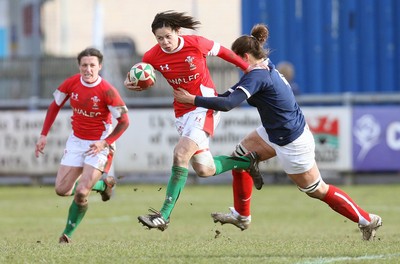 28.02.10 ... Wales Women v France Women, Womens Six Nations, Bridgend -  Wales' Naomi Thomas is tackled by France's Marie Charlotte Hebel   