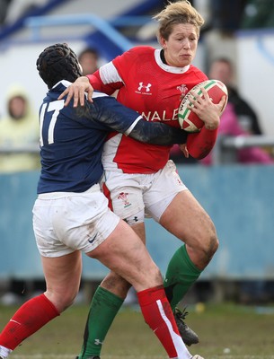 28.02.10 ... Wales Women v France Women, Womens Six Nations, Bridgend -  Wales' Gemma Hallett is tackled by France's Celine Barthelemy   