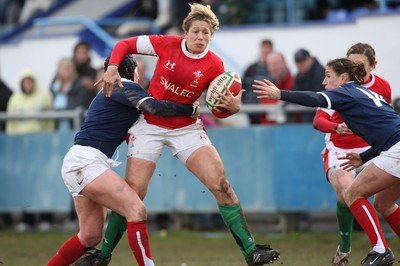 28.02.10 ... Wales Women v France Women, Womens Six Nations, Bridgend -  Wales' Gemma Hallett is tackled by France's Celine Barthelemy   