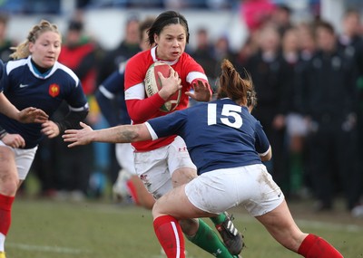 28.02.10 ... Wales Women v France Women, Womens Six Nations, Bridgend -  Wales' Naomi Thomas is tackled by France's Elodie Poublan  
