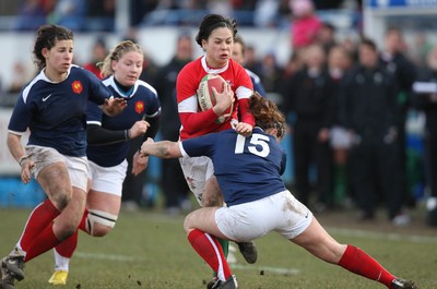 28.02.10 ... Wales Women v France Women, Womens Six Nations, Bridgend -  Wales' Naomi Thomas is tackled by France's Elodie Poublan  