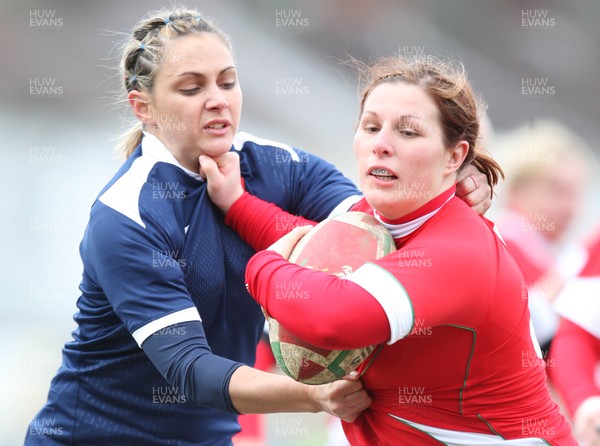 28.02.10 ... Wales Women v France Women, Womens Six Nations, Bridgend -  Wales' Jenny Davies holds off France's Marie-Alice Yahe  