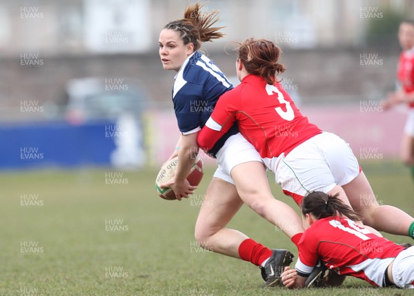 28.02.10 ... Wales Women v France Women, Womens Six Nations, Bridgend -  France's Elodie Poublan is tackled by Wales' Jenny Davies and Caryl James   