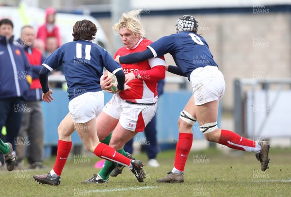 28.02.10 ... Wales Women v France Women, Womens Six Nations, Bridgend -  Wales' Catrin Edwards is caught by France's Sandra Rabier and France's Caroline Ladagnous   