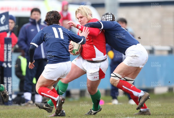 28.02.10 ... Wales Women v France Women, Womens Six Nations, Bridgend -  Wales' Catrin Edwards is caught by France's Sandra Rabier and France's Caroline Ladagnous   