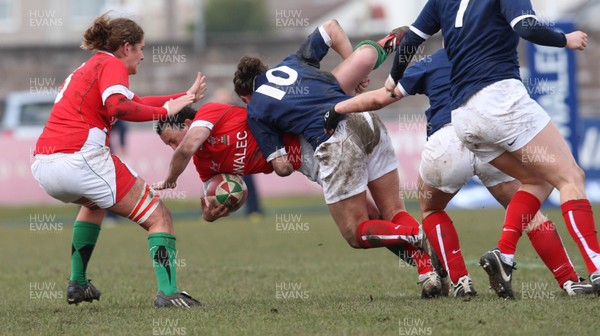 28.02.10 ... Wales Women v France Women, Womens Six Nations, Bridgend -  Wales' Awen Thomas is tackled by France's Aurelie Bailon   
