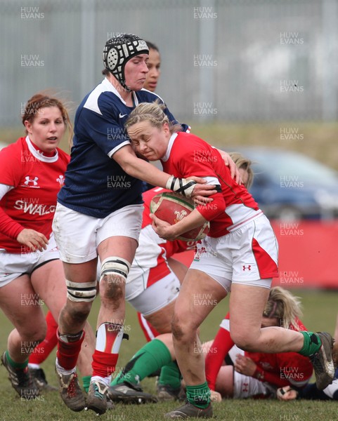 28.02.10 ... Wales Women v France Women, Womens Six Nations, Bridgend -  Wales' Laura Prosser is tackled by France's Amandine Vaupre   
