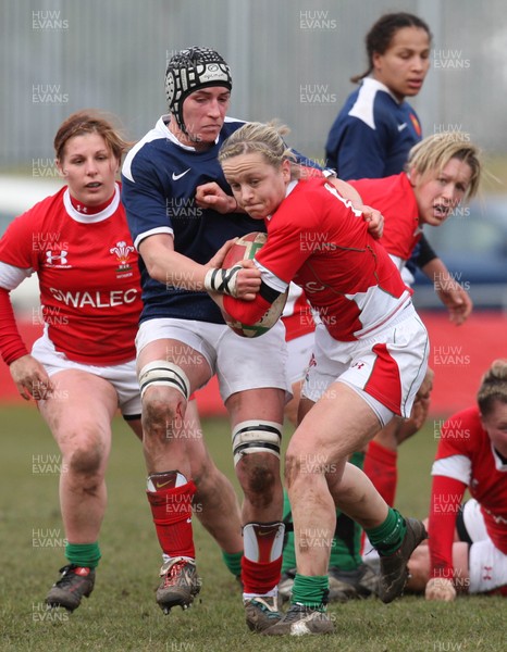 28.02.10 ... Wales Women v France Women, Womens Six Nations, Bridgend -  Wales' Laura Prosser is tackled by France's Amandine Vaupre   