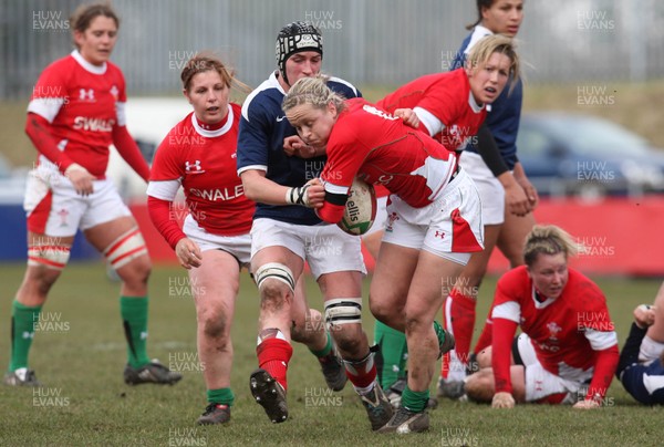 28.02.10 ... Wales Women v France Women, Womens Six Nations, Bridgend -  Wales' Laura Prosser is tackled by France's Amandine Vaupre   
