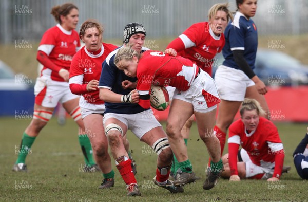 28.02.10 ... Wales Women v France Women, Womens Six Nations, Bridgend -  Wales' Laura Prosser is tackled by France's Amandine Vaupre   