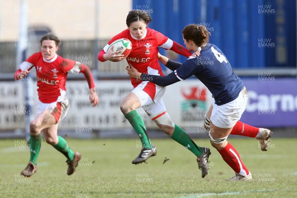 28.02.10 ... Wales Women v France Women, Womens Six Nations, Bridgend -  Wales' Naomi Thomas is tackled by France's Marie Charlotte Hebel   