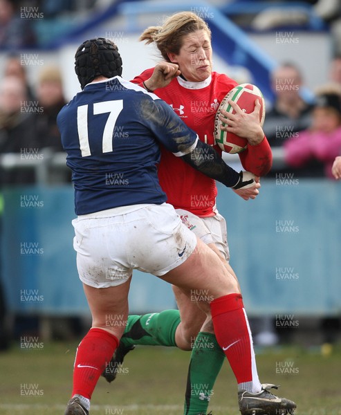 28.02.10 ... Wales Women v France Women, Womens Six Nations, Bridgend -  Wales' Gemma Hallett is tackled by France's Celine Barthelemy   