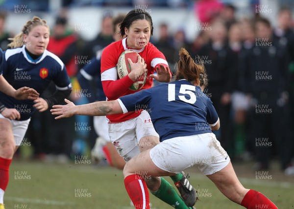28.02.10 ... Wales Women v France Women, Womens Six Nations, Bridgend -  Wales' Naomi Thomas is tackled by France's Elodie Poublan  