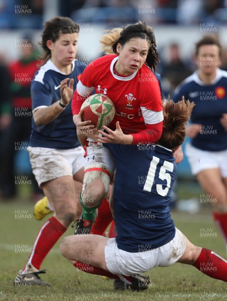 28.02.10 ... Wales Women v France Women, Womens Six Nations, Bridgend -  Wales' Naomi Thomas is tackled by France's Elodie Poublan  