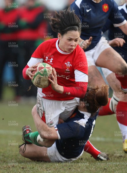 28.02.10 ... Wales Women v France Women, Womens Six Nations, Bridgend -  Wales' Naomi Thomas is tackled by France's Elodie Poublan  