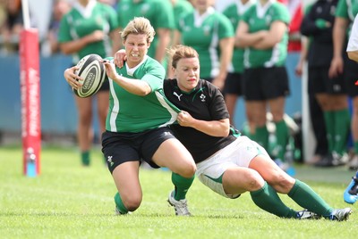 01.08.10.. Wales Women v Ireland Women, Women's Rugby World Cup 2010 Warm-Up Fixture -  Wales' Mared Evans is tackled by Irelands' Lynne Cantwell 