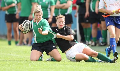 01.08.10.. Wales Women v Ireland Women, Women's Rugby World Cup 2010 Warm-Up Fixture -  Wales' Mared Evans is tackled by Irelands' Lynne Cantwell 