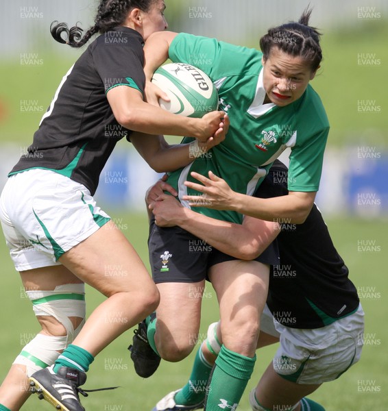 01.08.10.. Wales Women v Ireland Women, Women's Rugby World Cup 2010 Warm-Up Fixture -  Wales' Naomi Thomas is tackled by Ireland's Tania Rosser (lt) and Sinead Ryan  