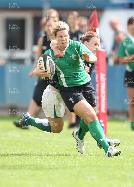 01.08.10.. Wales Women v Ireland Women, Women's Rugby World Cup 2010 Warm-Up Fixture -  Wales' Mared Evans is tackled by Irelands' Lynne Cantwell 