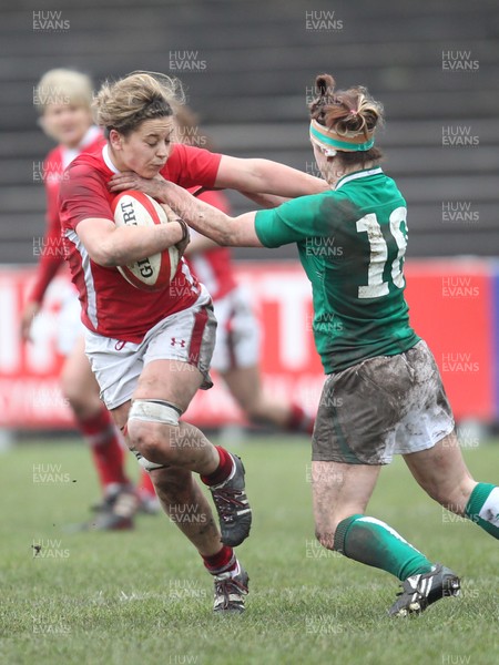 030213 - Wales Women v Ireland Women, 2013 RBS Womens 6 Nations, Aberavon - Wales' Sioned Harries holds off Ireland's Lynne Cantwell 