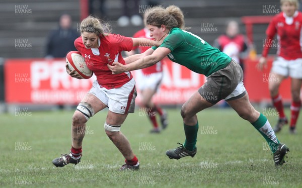 030213 - Wales Women v Ireland Women, 2013 RBS Womens 6 Nations, Aberavon - Wales' Sioned Harries holds off Ireland's Jenny Murphy