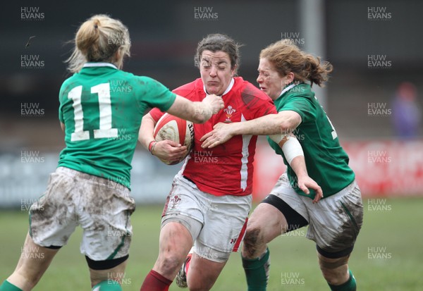 030213 - Wales Women v Ireland Women, 2013 RBS Womens 6 Nations, Aberavon - Wales' Elen Evans is tackled by Ireland's Grace Davitt and Ireland's Alison Miller