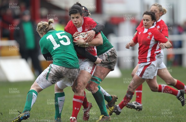 030213 - Wales Women v Ireland Women, 2013 RBS Womens 6 Nations, Aberavon - Wales' Rebecca de Filippo is tackled by Ireland's Niamh Briggs and Ireland's Joy Neville