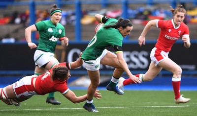 100421 - Wales Women v Ireland Women - Women's Six Nations - Hannah Tyrrell of Ireland is tackled by Natalia John of Wales